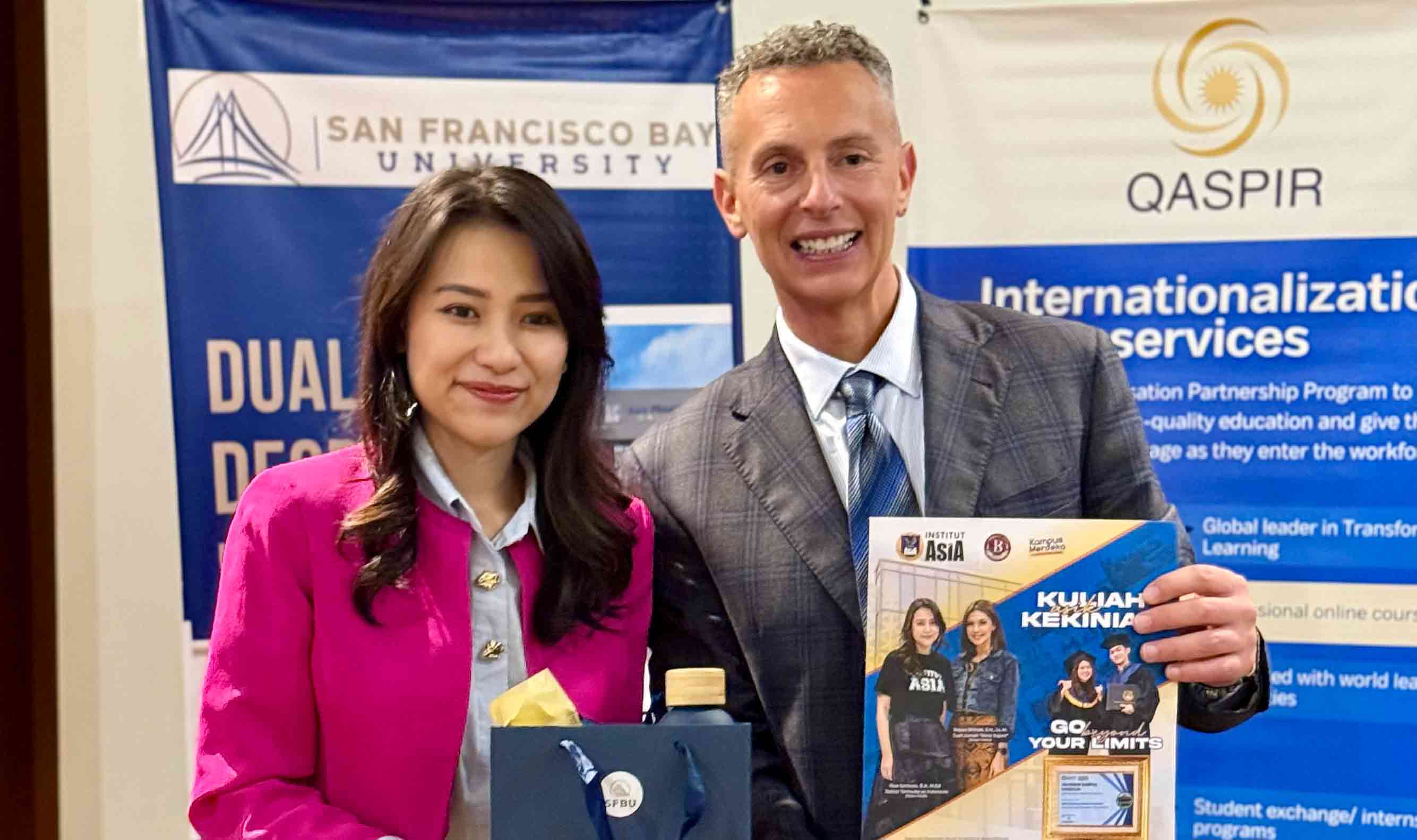 Male and female smiling towards the camera