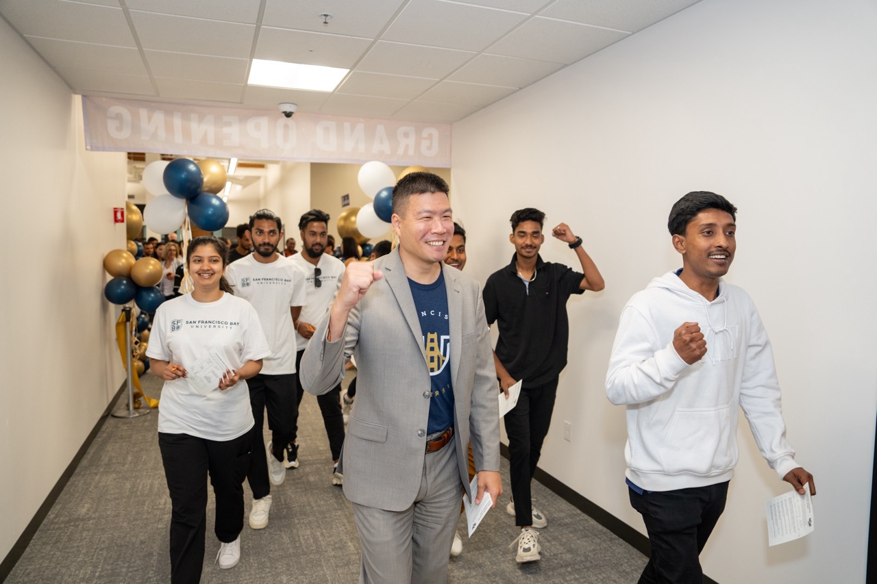 Following the ribbon-cutting event, students, staff and faculty joyously walk to the new Student Lounge and Student Success Hub together.