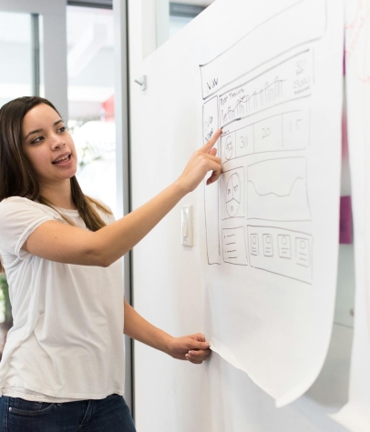 Photo Of Woman Pointing On White Paper