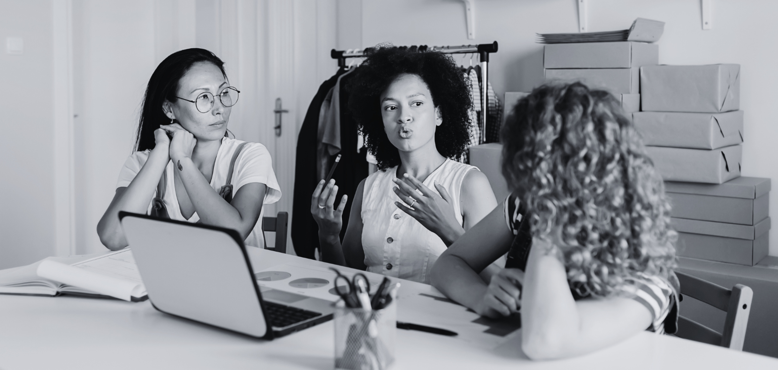 women in front of a laptop