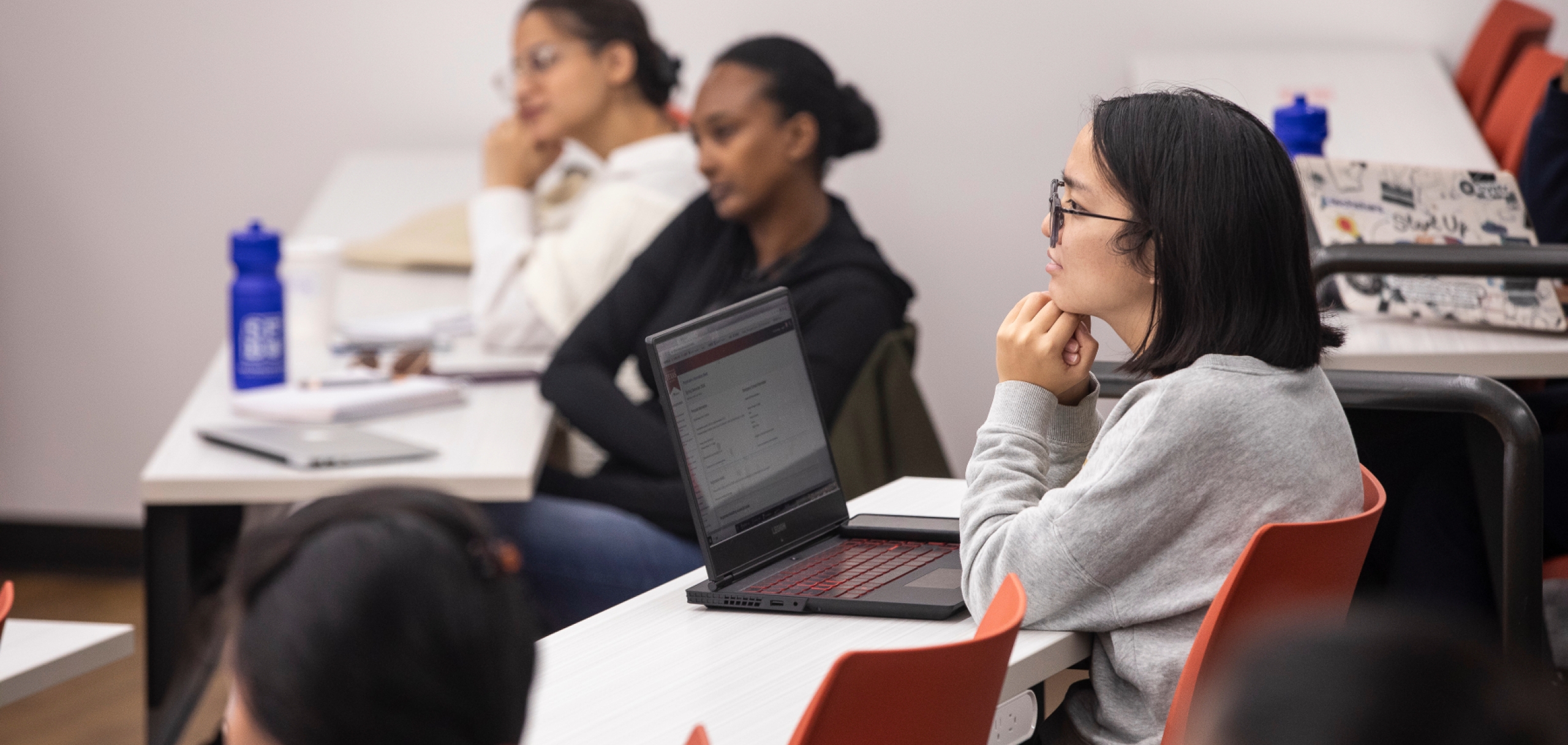 A female student is listening a lecture in the lecture hall