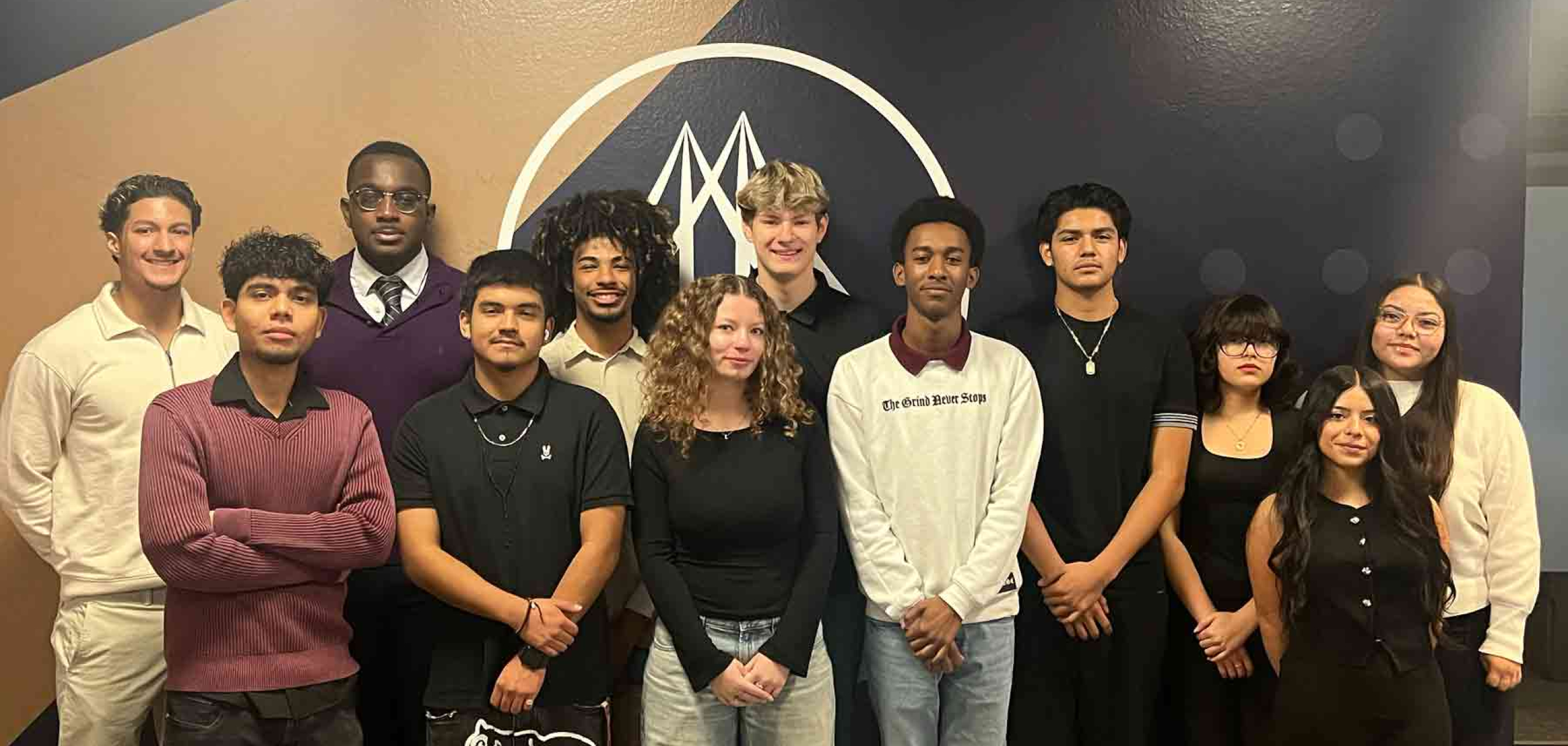 Scholar students in standing and smiling for a group picture