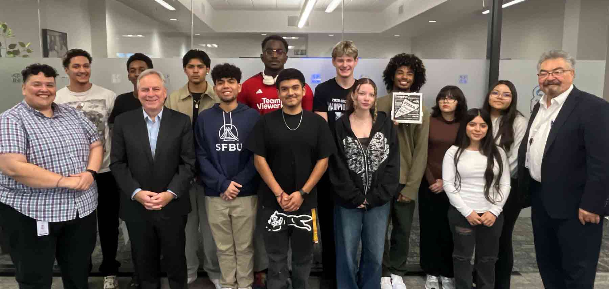 Startup scholar students standing and smiling for a group picture