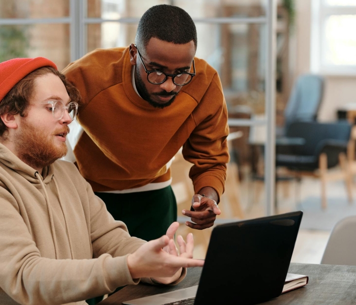 Diverse colleagues brainstorming together in a modern office, fostering teamwork and creativity.