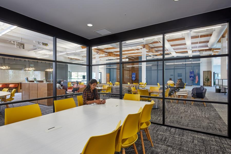 Student studying in the enclosed glass study space